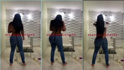 Angela Grajales with jeans taking the blouse