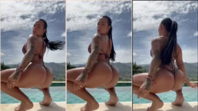 Jennifer Sánchez wiggling on the pool edge